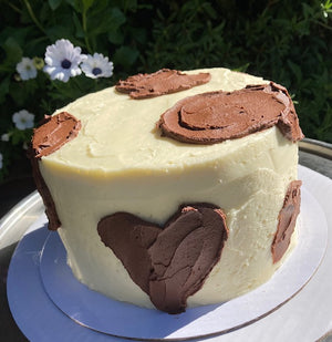 Holstein Cake:  Chocolate & White Cake frosted with vanilla and chocolate buttercream.